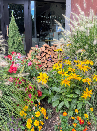 Woodgrain storefront with flowering landscape